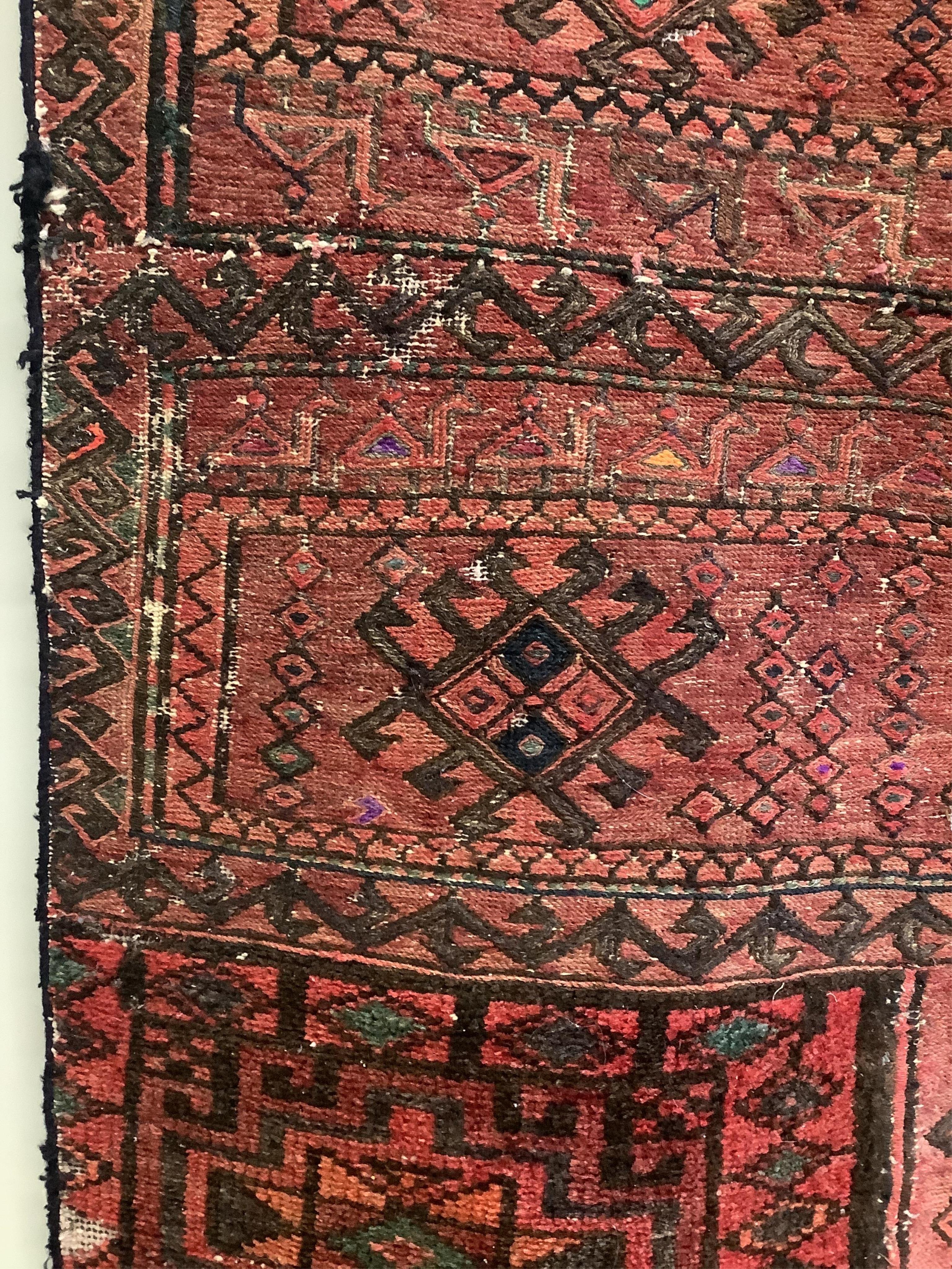 A saddlebag sampler carpet, 222 x 92cm. Condition - fair